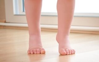 Toddler walking on tip toes