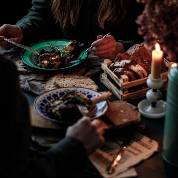 People eating a meal by candle light