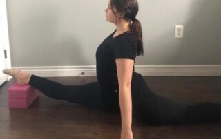 woman doing an over split