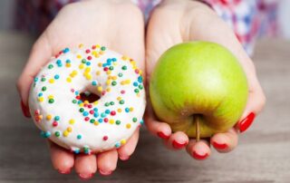 Choice between a doughnut and an apple.