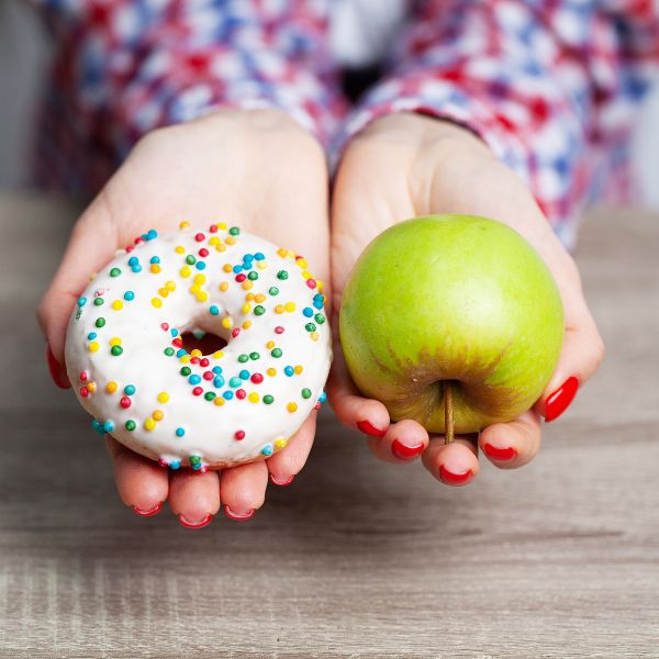 Choice between a doughnut and an apple.