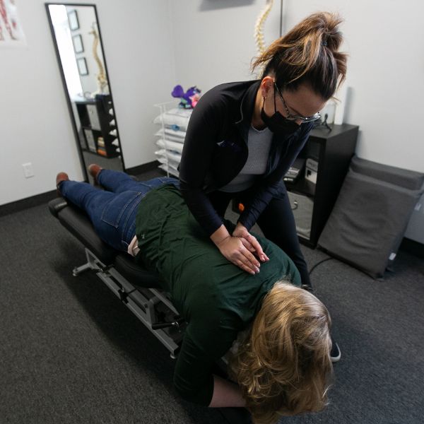 Female chiropractor doing an adjustment of a female patient.