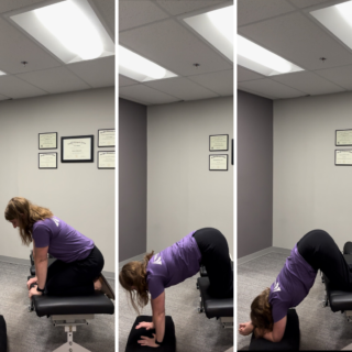 Caucasian female chiropractor demonstration Forward Leaning Inversion.