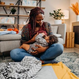 Black mother breastfeeding her baby.