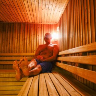 Caucasian man relaxing in a sauna