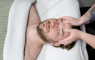 Caucasian man receiving a scalp massage.