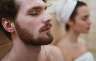 caucasian man and woman using sauna