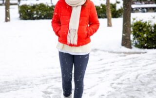 caucasian woman bundled up for an icy winter walk